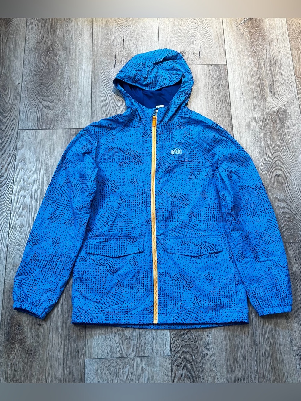 REI Kids' Bright Blue Hooded Rain Jacket with Yellow Zipper, Size L (14-16)
